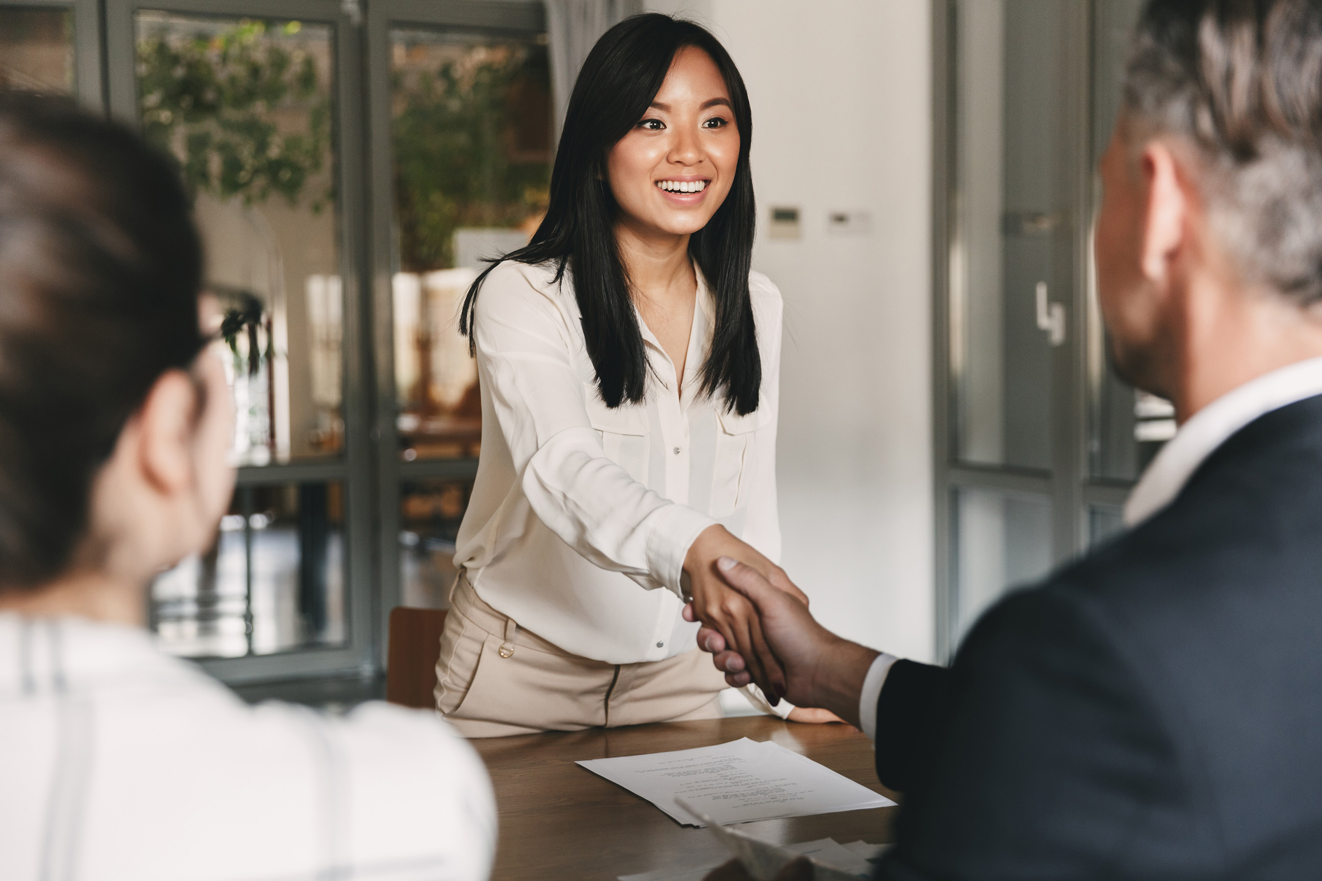 woman shaking hand at jp management